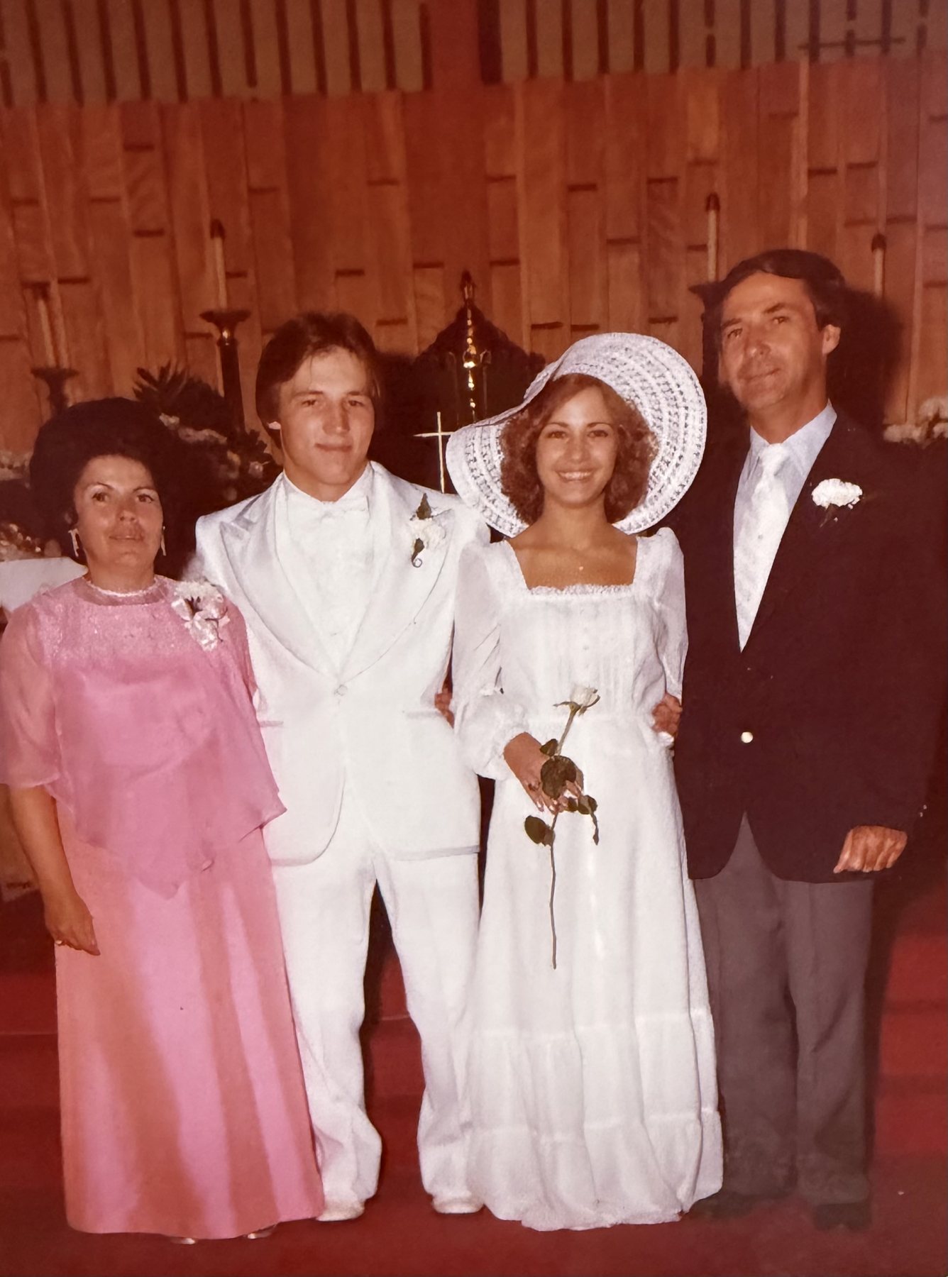Linda and Rich with family at the altar